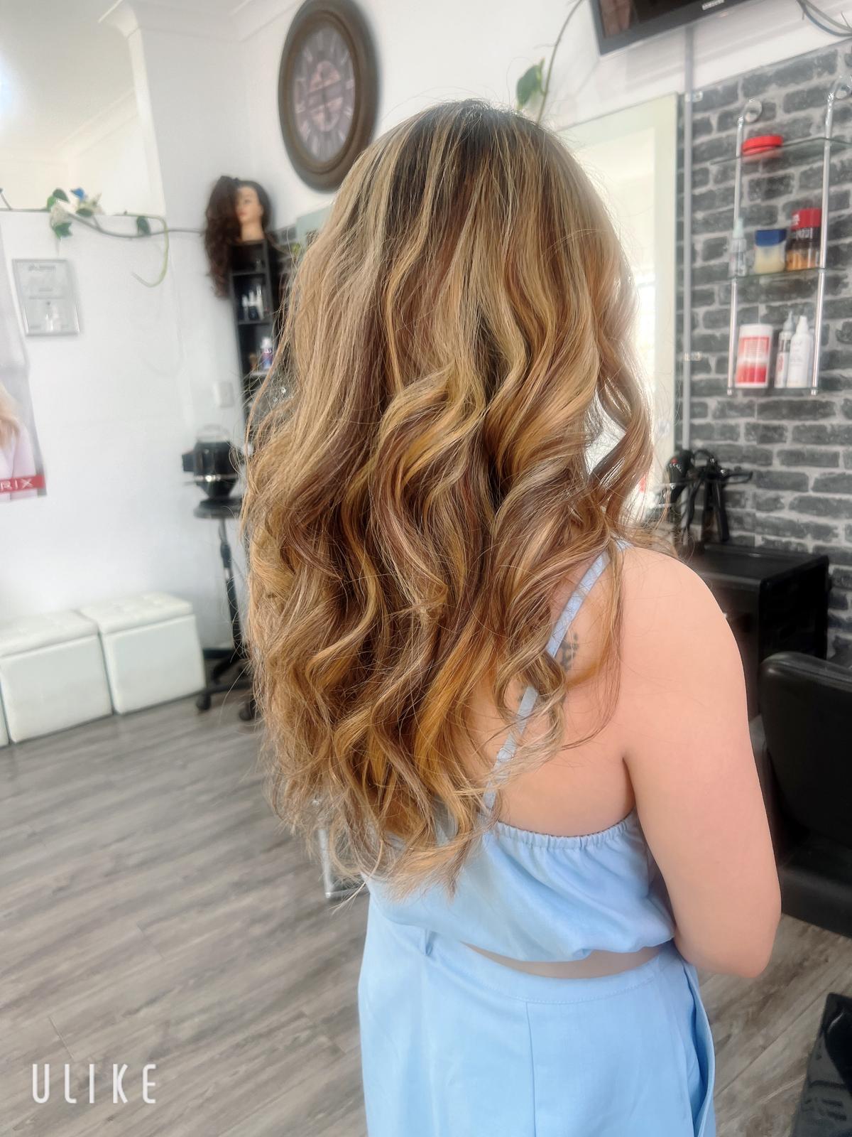 Long honey balayage waves styled at Catherine's Hair & Beauty Marrickville